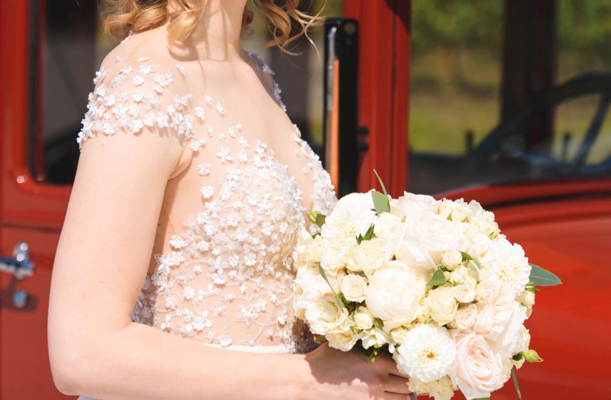 Bride in lace wedding dress and flowers