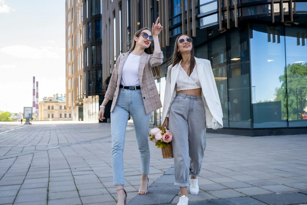 one woman wearing an old money style outfit and another woman wearing baggy clothes